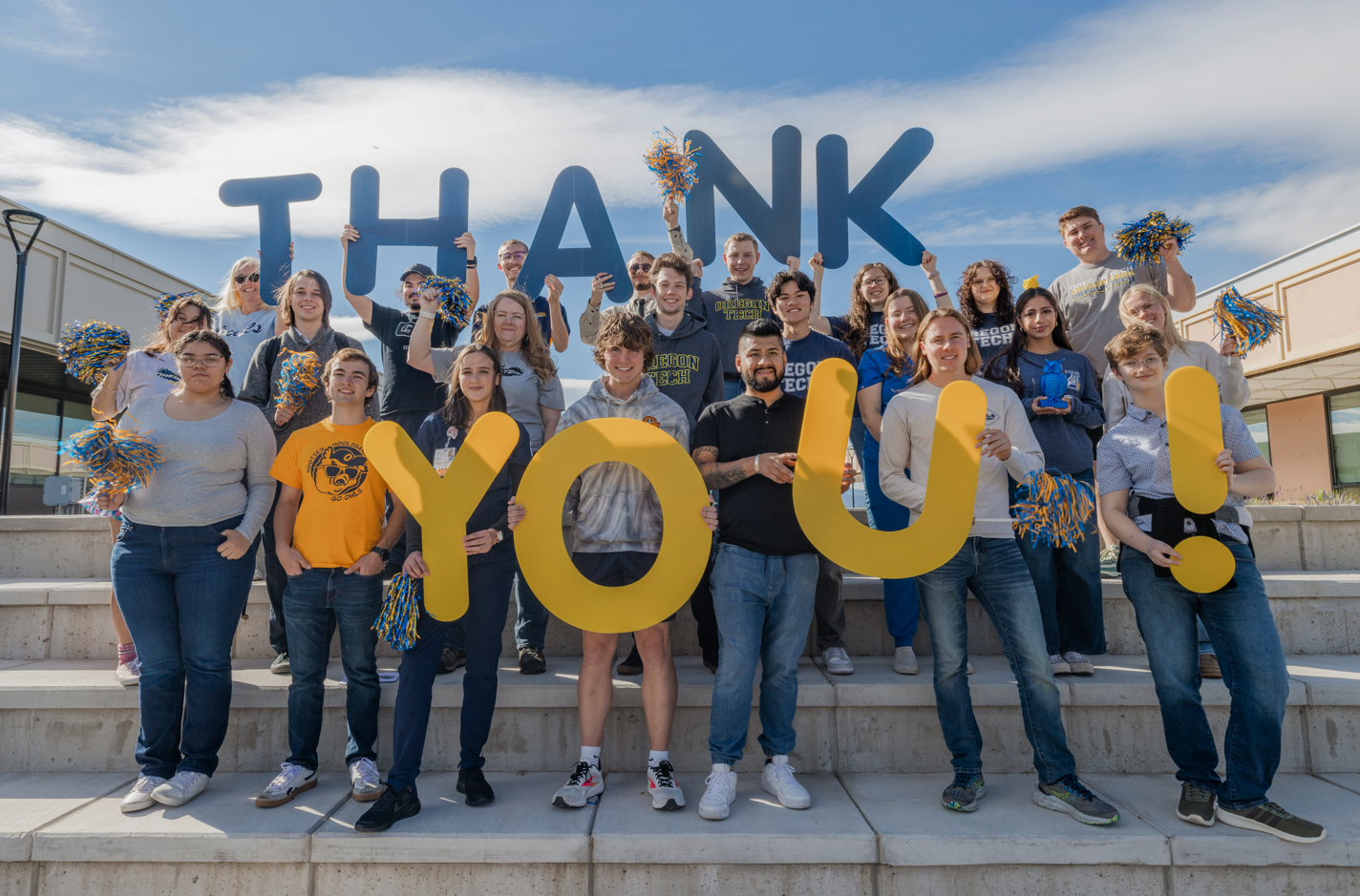 Students holding a Thank You sign