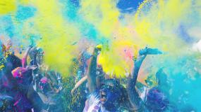 Colorful dust over crowd